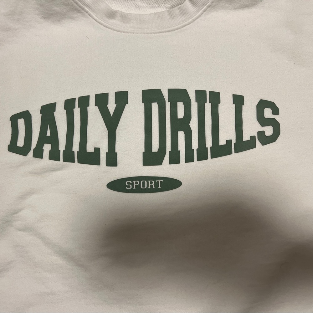 Daily Drills White Sweater with Green Logo